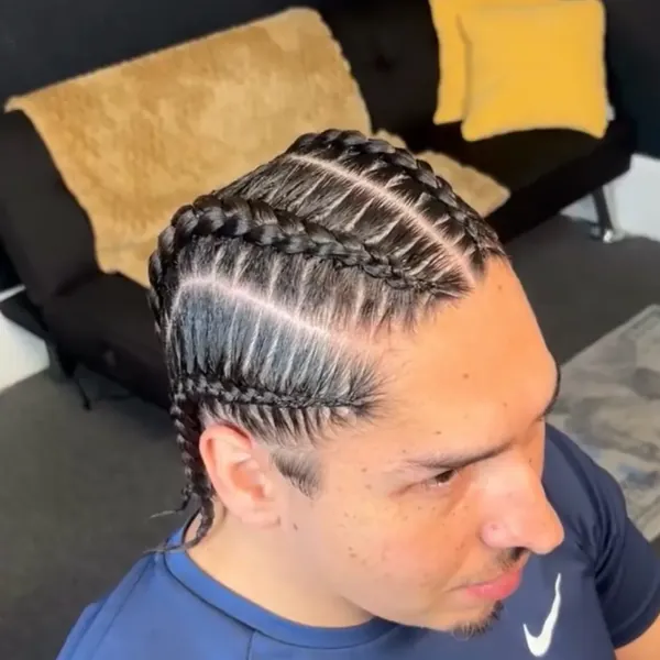 Four evenly-spaced stitch braids in a clean cornrow pattern