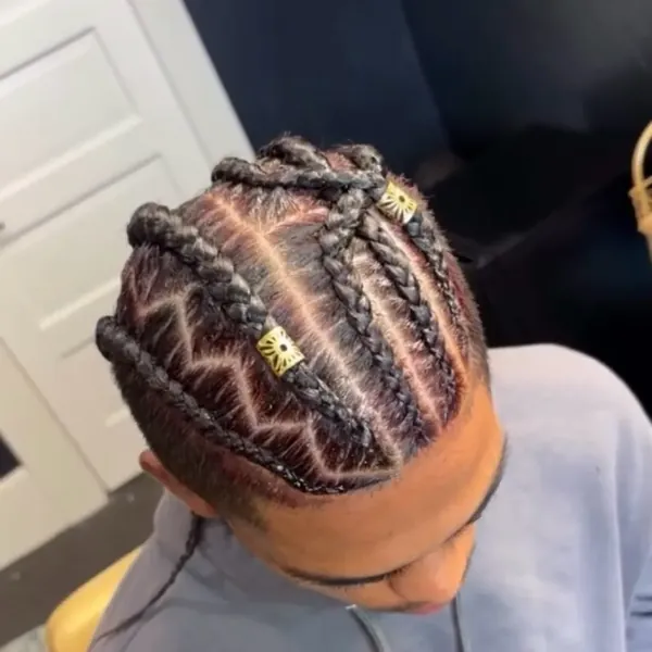 Freestyle braided pattern across the crown of the head