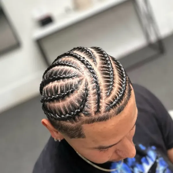 Full-head freestyle braids in a sculpted decorative pattern